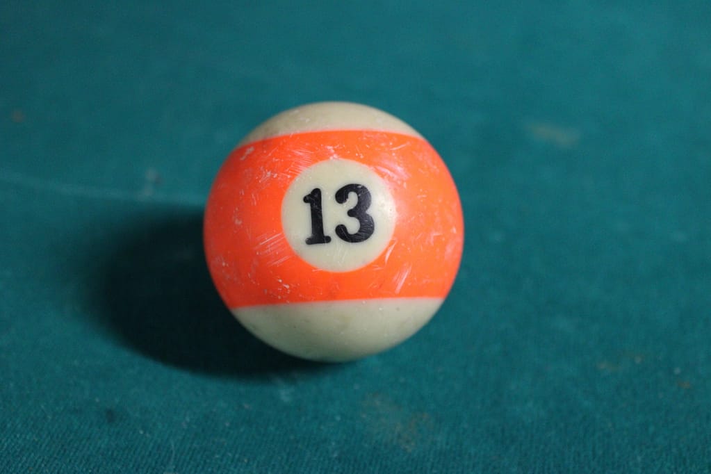 Orange snooker ball with number 13