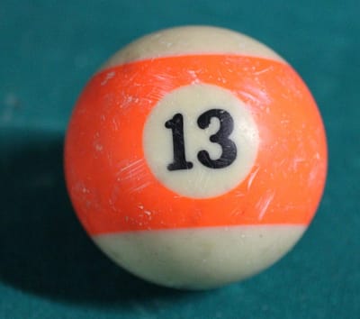 Orange snooker ball with number 13